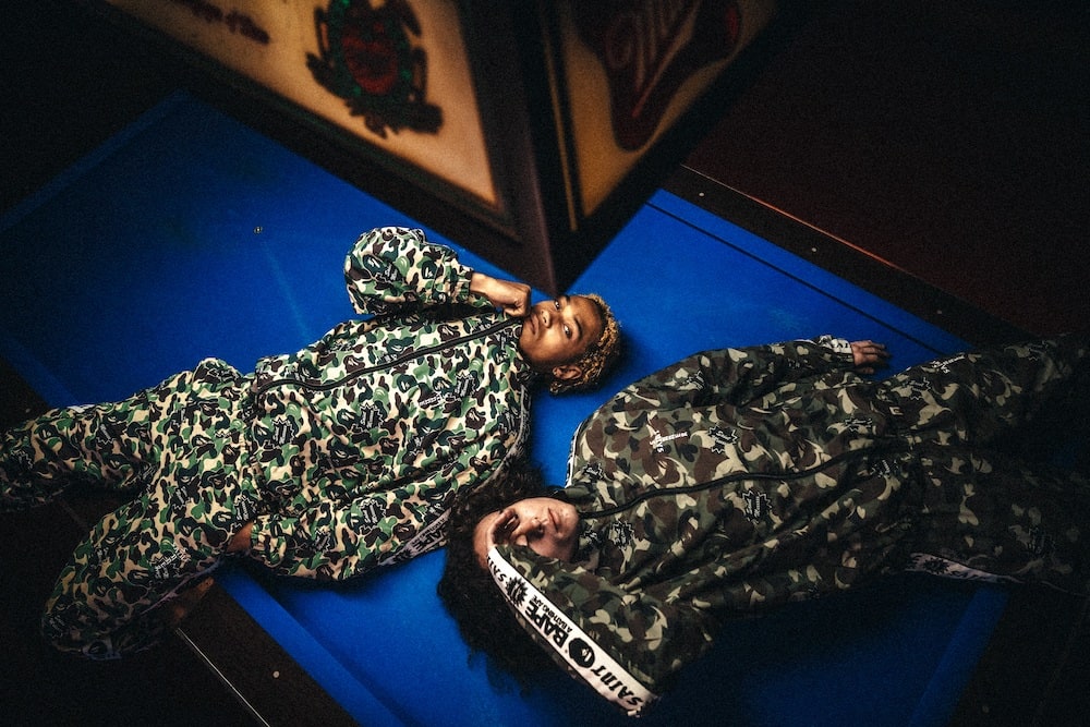 A BATHING APE® × SAINT Mxxxxxx STAPE Track Pants