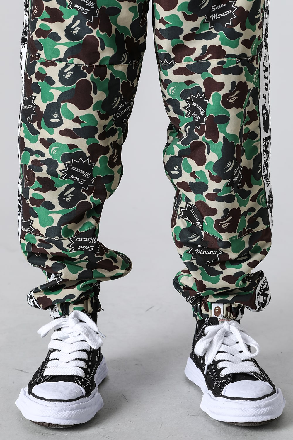 A BATHING APE® × SAINT Mxxxxxx STAPE Track Pants