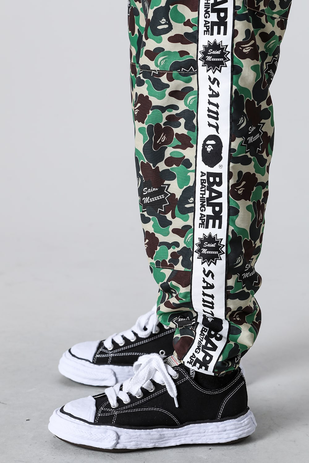 A BATHING APE® × SAINT Mxxxxxx STAPE Track Pants