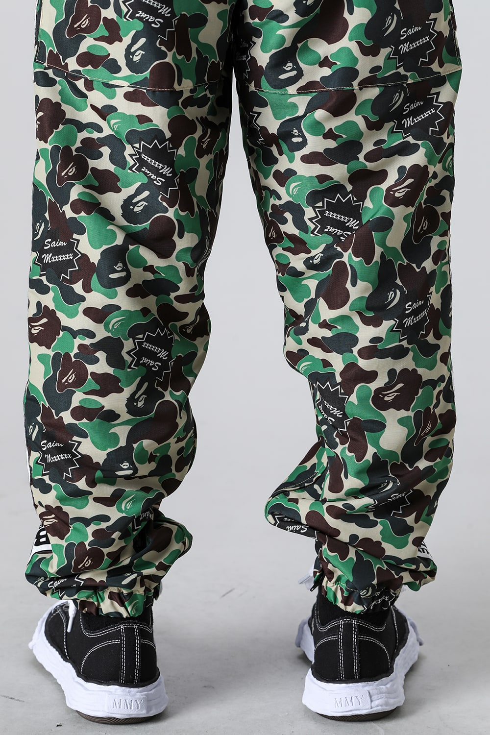 A BATHING APE® × SAINT Mxxxxxx STAPE Track Pants