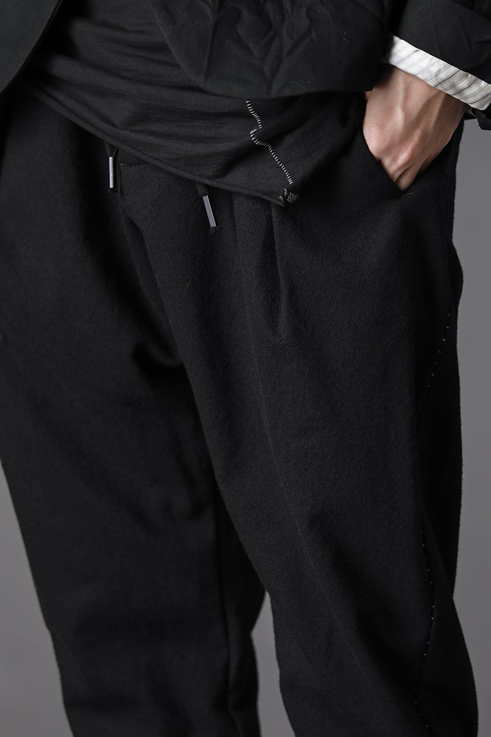 STRETCH WOOL BAGGY PANTS