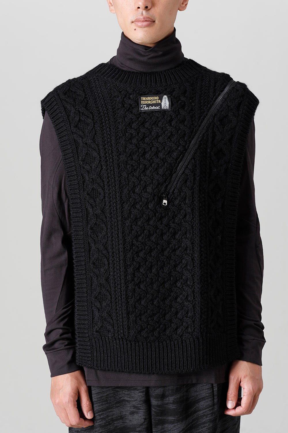 reverse double zip aran pattern vest Black