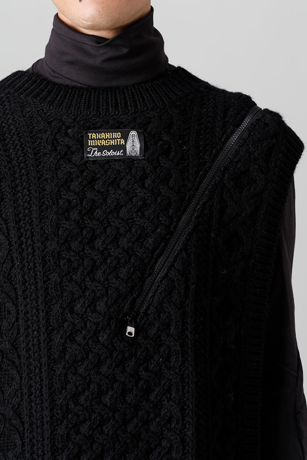 reverse double zip aran pattern vest Black