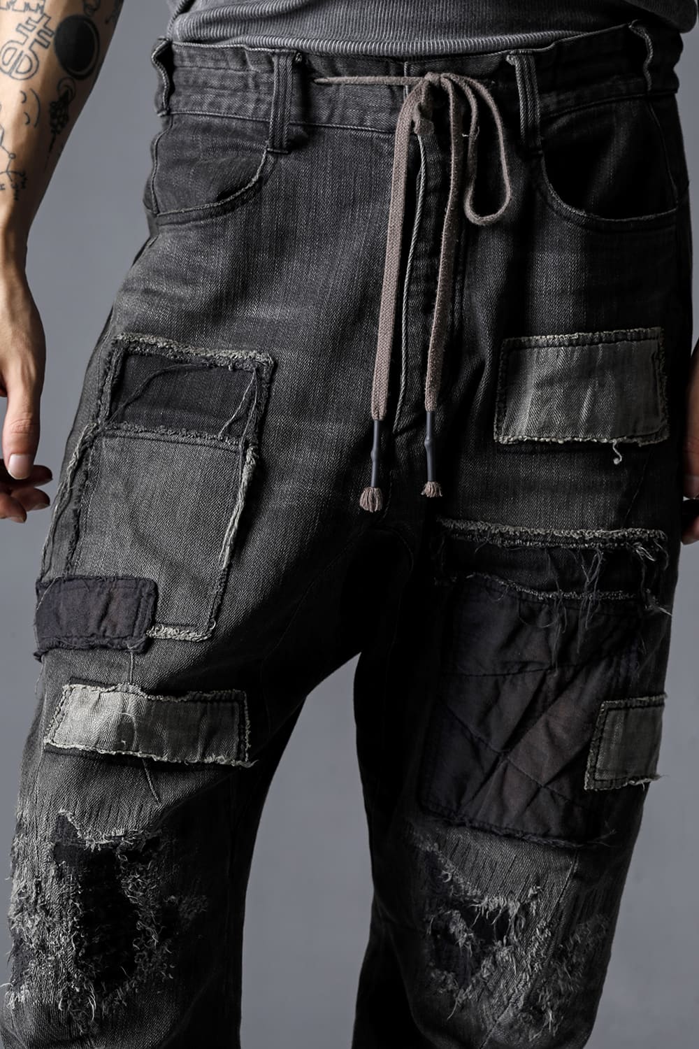 Damage Repair Curved Tapered Drop Crotch Denim Pants